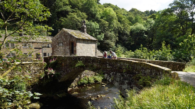 Visitors on a bridge at Hardcastle Crags, West Yorkshire.